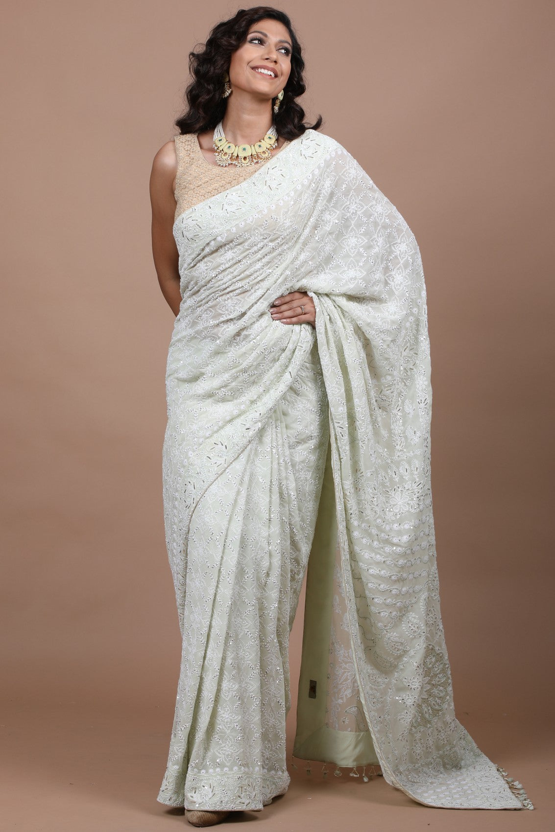 Elegant Pista Green Chikankari Georgette Saree with Traditional Embroidery & Embellishments