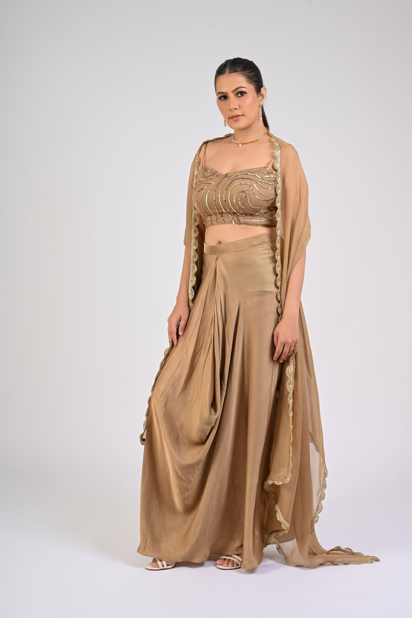 Dull Gold Satin-Silk Draped Skirt Set with Sequined Blouse & Organza Cape – Luxury Wedding Wear